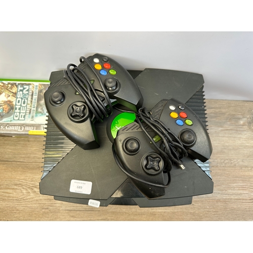 689 - Eleven Microsoft Xbox original items, two consoles, two third party controllers and seven games