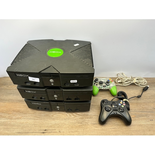 691 - Five Microsoft Xbox original items, three consoles and two controllers