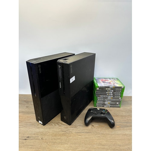 693 - Two Microsoft Xbox One consoles, controller and games to include FIFA 15, FIFA 16 and FIFA 17 etc.