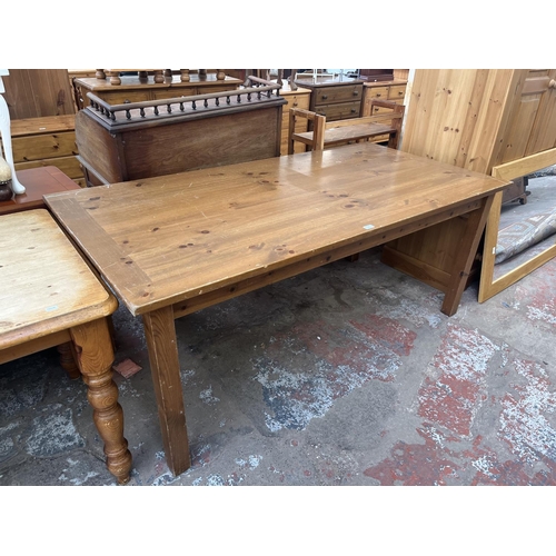 72 - A pine rectangular dining table - approx. 76cm high x 92cm wide x 183cm long