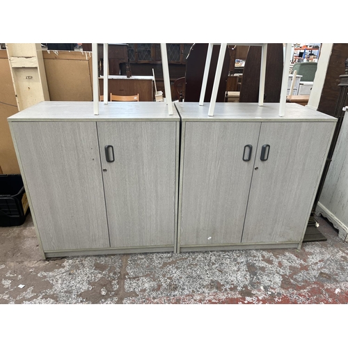 77 - A pair of modern grey laminate two door office cabinets