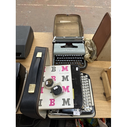 739 - Two cased vintage portable typewriters, one Olympia Splendid 66 and one Olivetti Lettera 22 with ins... 