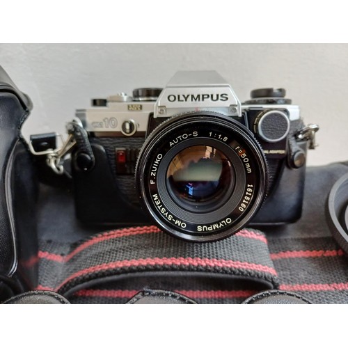 625 - A camera case containing cased Olympus OM10 35mm SLR camera fitted with F.Zuiko 1:1.8 f=50mm lens, V... 