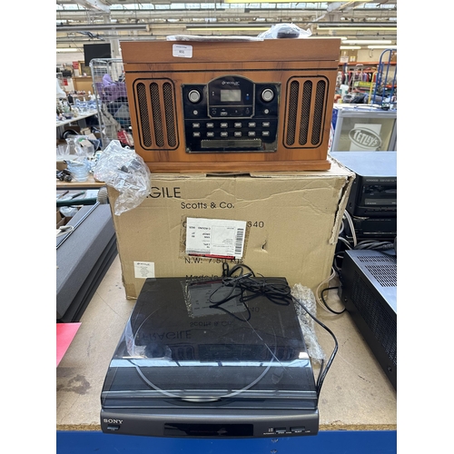 651 - Two items, one boxed Neostar electronics 2000926 retro style music system comprising turntable, cass... 