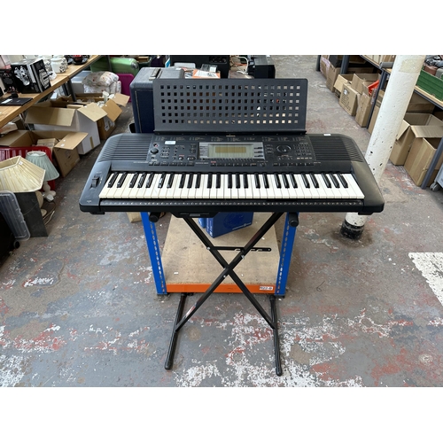 737 - A Yamaha PSR-630 electronic keyboard with Procore stand