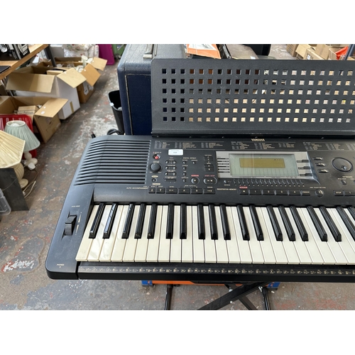 737 - A Yamaha PSR-630 electronic keyboard with Procore stand