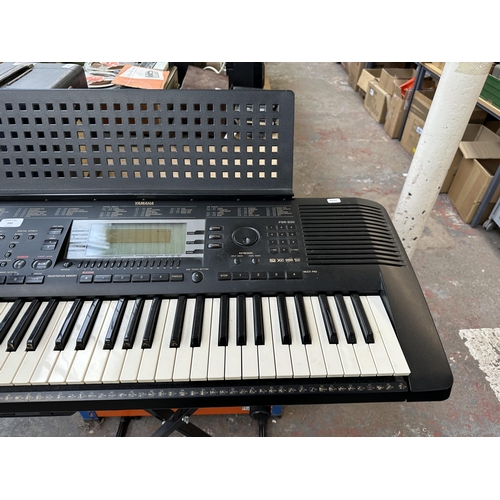 737 - A Yamaha PSR-630 electronic keyboard with Procore stand