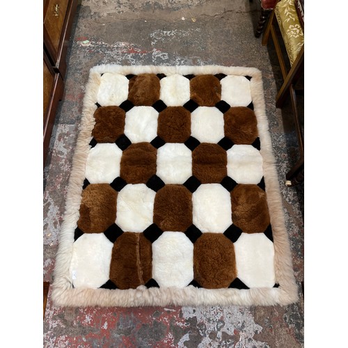 14 - An Alpaca fur rug - approx. 140cm x 108cm