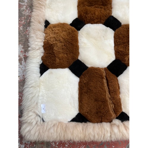 14 - An Alpaca fur rug - approx. 140cm x 108cm