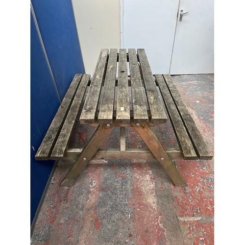 120 - A wooden picnic bench - approx. 75cm high x 127cm wide x 149cm long