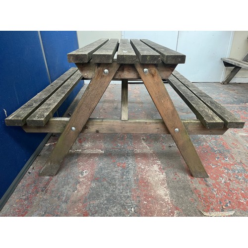 120 - A wooden picnic bench - approx. 75cm high x 127cm wide x 149cm long