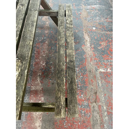 120 - A wooden picnic bench - approx. 75cm high x 127cm wide x 149cm long