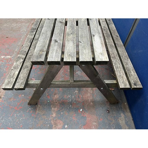 120 - A wooden picnic bench - approx. 75cm high x 127cm wide x 149cm long