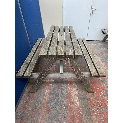 123 - A wooden picnic bench - approx. 75cm high x 127cm wide x 149cm long