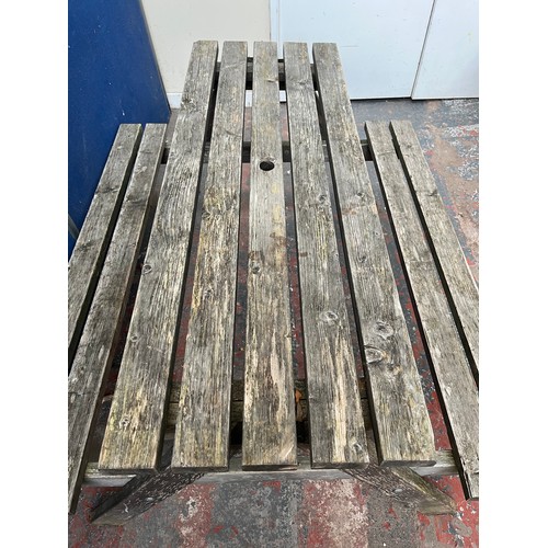 123 - A wooden picnic bench - approx. 75cm high x 127cm wide x 149cm long