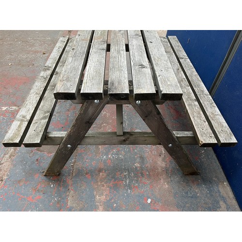 122 - A wooden picnic bench - approx. 75cm high x 127cm wide x 149cm long