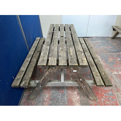 127 - A wooden picnic bench - approx. 75cm high x 127cm wide x 149cm long