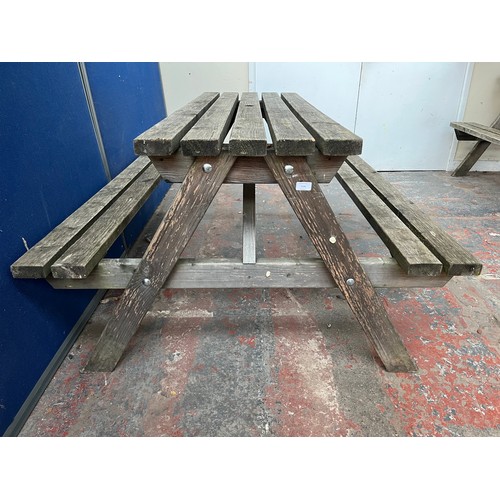 127 - A wooden picnic bench - approx. 75cm high x 127cm wide x 149cm long