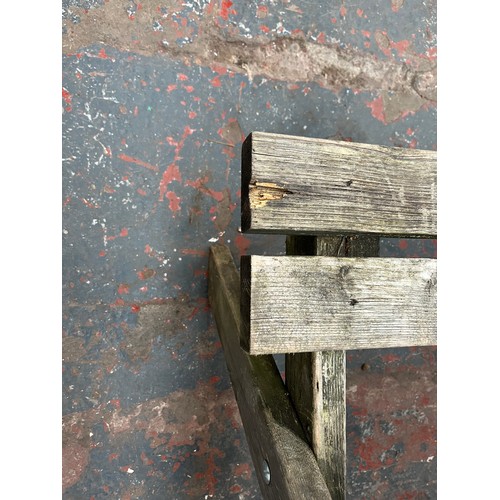 127 - A wooden picnic bench - approx. 75cm high x 127cm wide x 149cm long