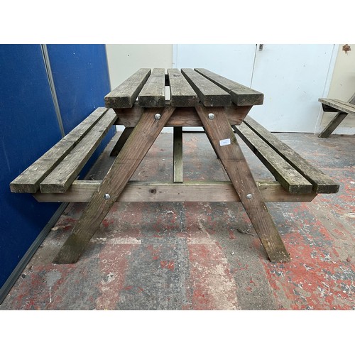 124 - A wooden picnic bench - approx. 75cm high x 127cm wide x 149cm long