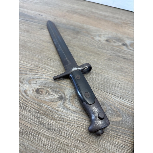 536 - A WWII Spanish M44 bayonet with original brown leather scabbard