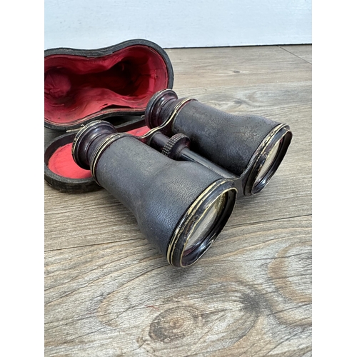 538 - Two items, American USAAF canvas bag and a pair of antique leather cased binoculars