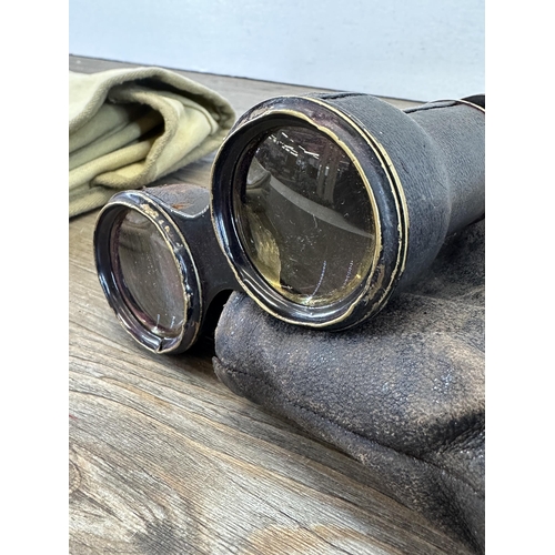 538 - Two items, American USAAF canvas bag and a pair of antique leather cased binoculars