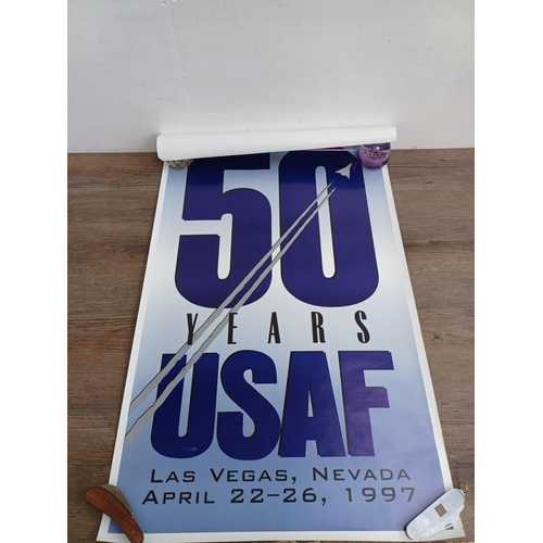 711A - A collection of The Beatles calendars and posters to include 'Victory Times Square 1945', 'Area 51 K... 