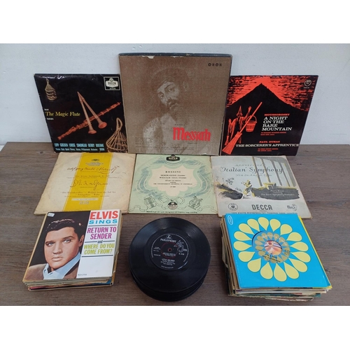 716 - A collection of vinyl records to include Elvis Presley, The Beatles, The Doors, David Bowie, Chuck B... 