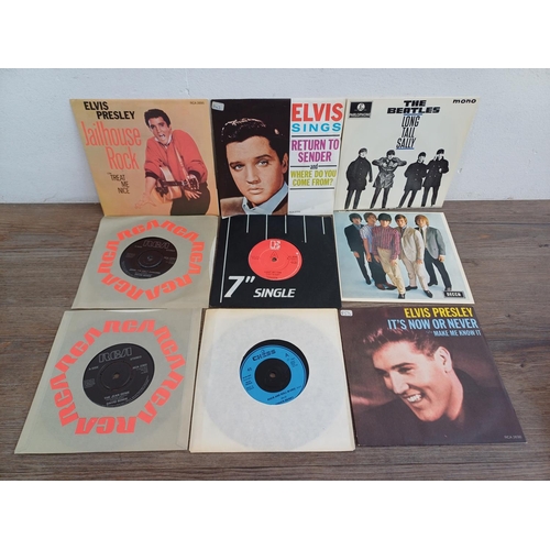 716 - A collection of vinyl records to include Elvis Presley, The Beatles, The Doors, David Bowie, Chuck B... 