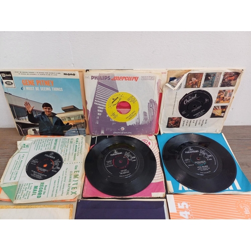 716 - A collection of vinyl records to include Elvis Presley, The Beatles, The Doors, David Bowie, Chuck B... 