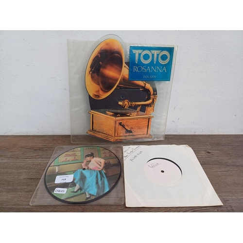 719 - Three vinyl singles, one Toto 'Rosanna' shaped picture disc (WA 2079), one Andrew Matheson 'True Rom... 