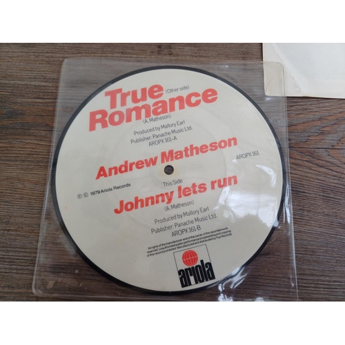 719 - Three vinyl singles, one Toto 'Rosanna' shaped picture disc (WA 2079), one Andrew Matheson 'True Rom... 