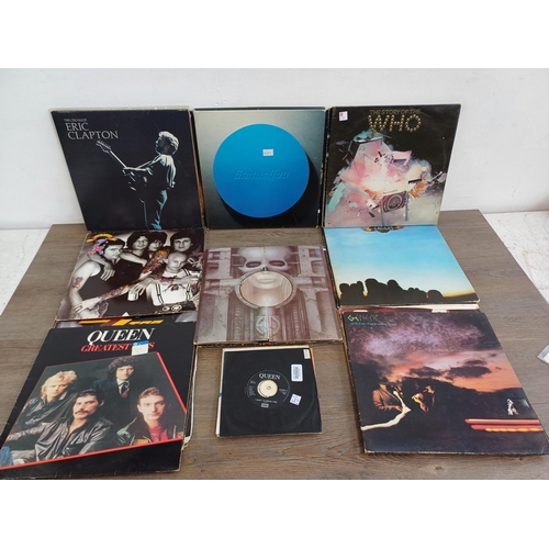 723 - A collection of vinyl records to include Queen, Status Quo, Whitesnake, Genesis, Rainbow, ZZ Top, Me... 