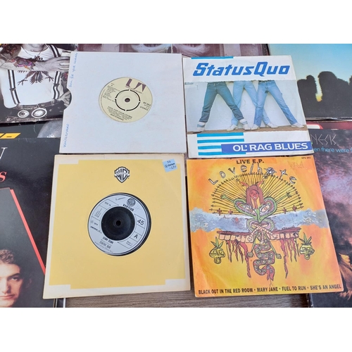 723 - A collection of vinyl records to include Queen, Status Quo, Whitesnake, Genesis, Rainbow, ZZ Top, Me... 