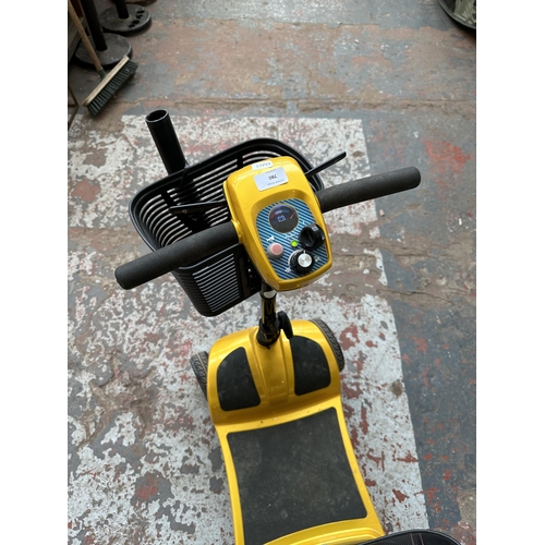 780 - A mobility scooter with battery, charger and key