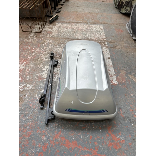 782 - Two items, one Ford car roof box and one pair of car roof bars