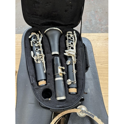 738 - Four items one cased Sonata clarinet, one cased Tatra by Rosetti violin with bow and rosin, one tamb... 