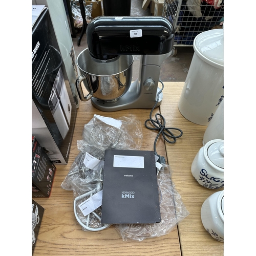 748 - A Kenwood kMix KMX50 stand mixer with bowl, attachments and instruction manual