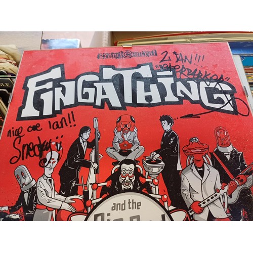 708 - A collection of items to include James Bond VHS box set, Fingathing poster signed by Simon 'Sneaky' ... 