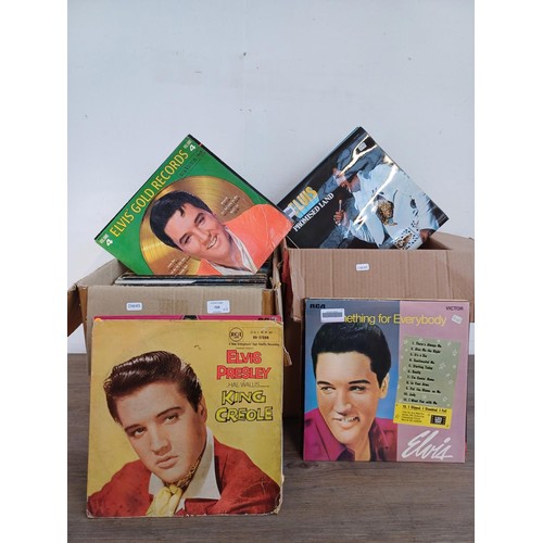 709 - Two boxes containing a large collection of LP vinyl records to include sixteen Elvis Presley, Rod St... 