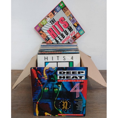 710 - A collection of LP vinyl record compilations to include Deep Heat Play With Fire 4, The Hits Album 1... 