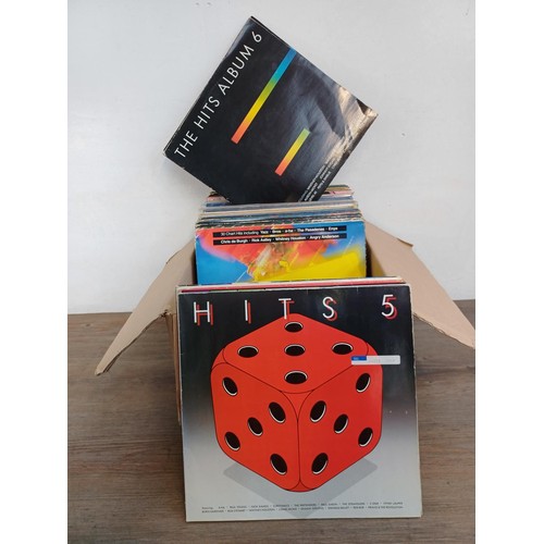 710 - A collection of LP vinyl record compilations to include Deep Heat Play With Fire 4, The Hits Album 1... 