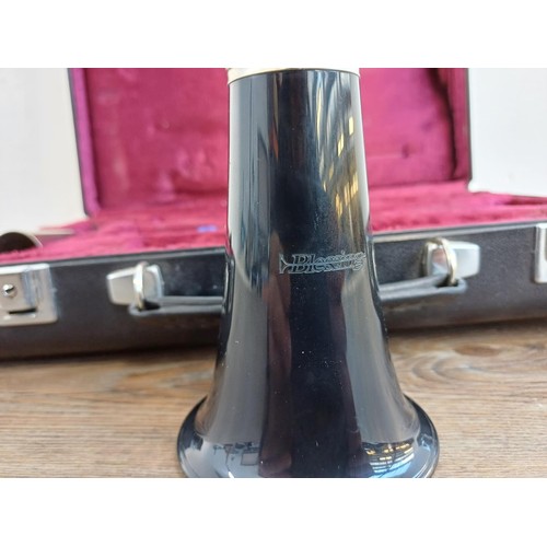 730 - A cased Blessing clarinet with Rico Royal mouthpiece, reeds and cork grease