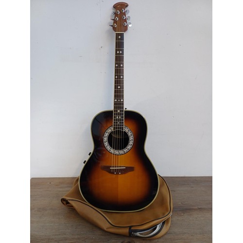 734 - A cased vintage Celebrity by Ovation CC67 bowl-back six string electro-acoustic guitar