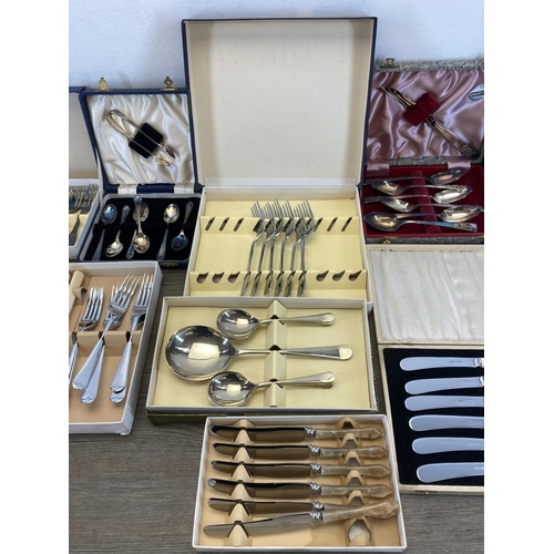 326 - Eleven vintage cased cutlery sets