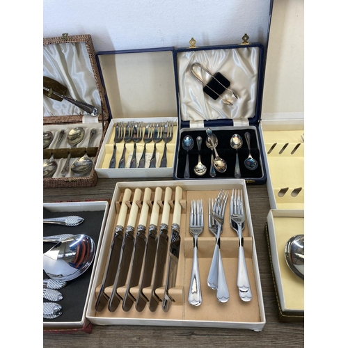 326 - Eleven vintage cased cutlery sets