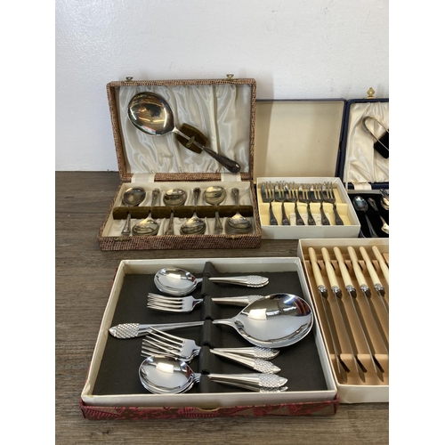 326 - Eleven vintage cased cutlery sets