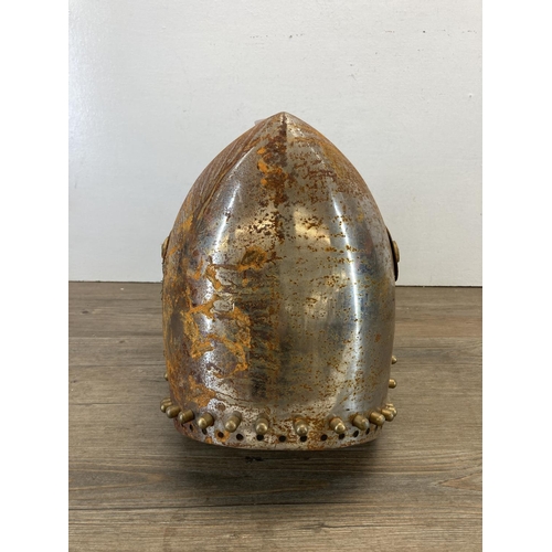 330 - A medieval style shaped metal reenactment helmet