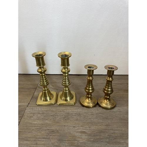 335 - A collection of copper and brassware to include a pair of 25cm brass candlesticks, brass table lamp,... 